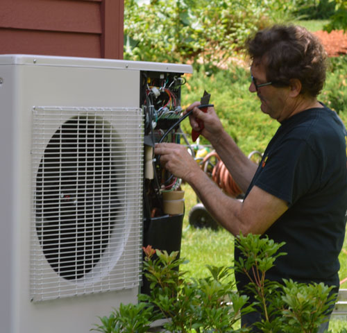 ckSmithSuperior technician checking coolent levels in AC compressor